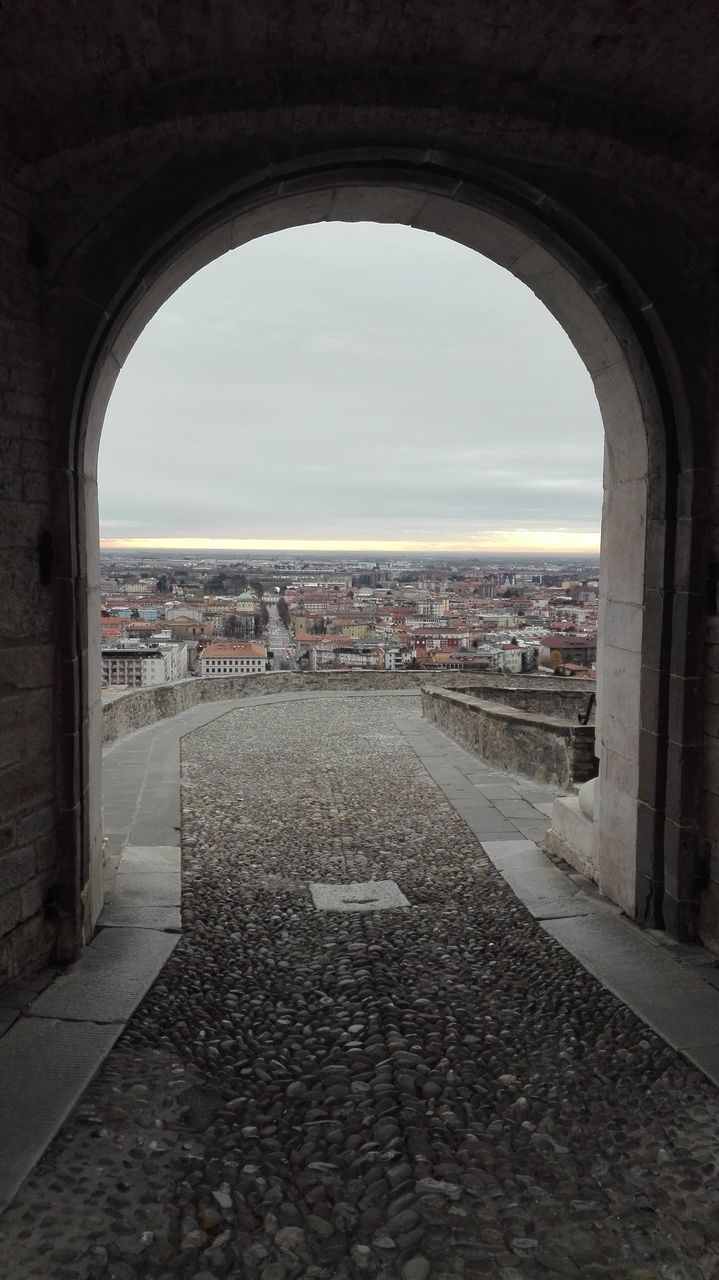 arch, architecture, built structure, day, sky, indoors, no people, travel destinations, city, building exterior, cityscape