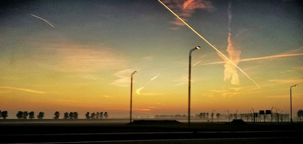 Scenic view of landscape against dramatic sky