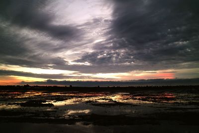 Scenic view of sea against cloudy sky