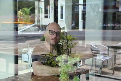 Reflection of man on glass