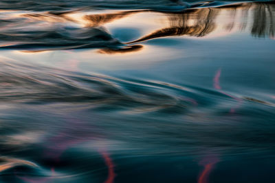 Blurred motion of sea against sky