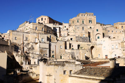 Low angle view of old ruins against clear sky