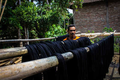 The craftsmen do the dyeing process of the fabric lurik in tringsing village, , indonesia