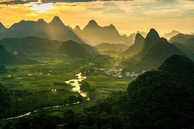 Scenic view of mountains against sky during sunset