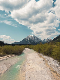 Road amidst mountains against sky