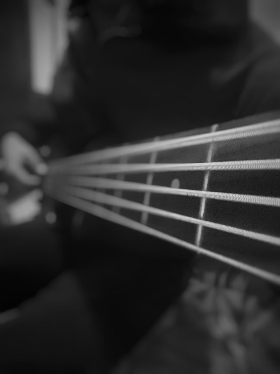 string instrument, guitar, music, musical instrument, arts culture and entertainment, human hand, string, hand, selective focus, indoors, real people, one person, musical instrument string, fretboard, musical equipment, lifestyles, close-up, human body part, playing, leisure activity, acoustic guitar, finger