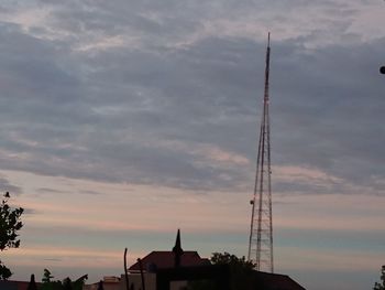 Low angle view of silhouette buildings against sky during sunset