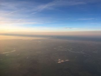 Aerial view of landscape against blue sky