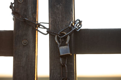 Close-up of padlock on metal fence