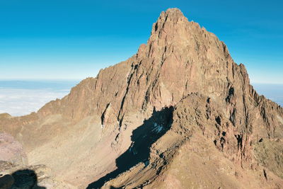 Mount kenya's highest peak, batian peak above the clouds at mount kenya