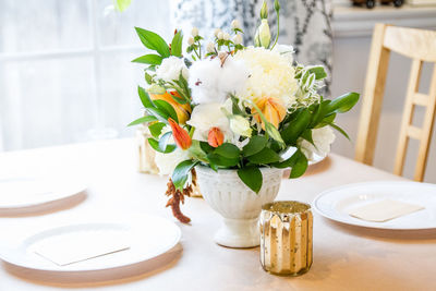 Close-up of white flower vase on table