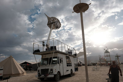 Traditional windmill against sky