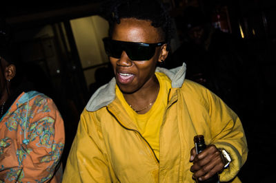 Young man holding yellow wearing mask