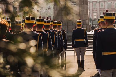 Rear view of military soldiers standing at parade