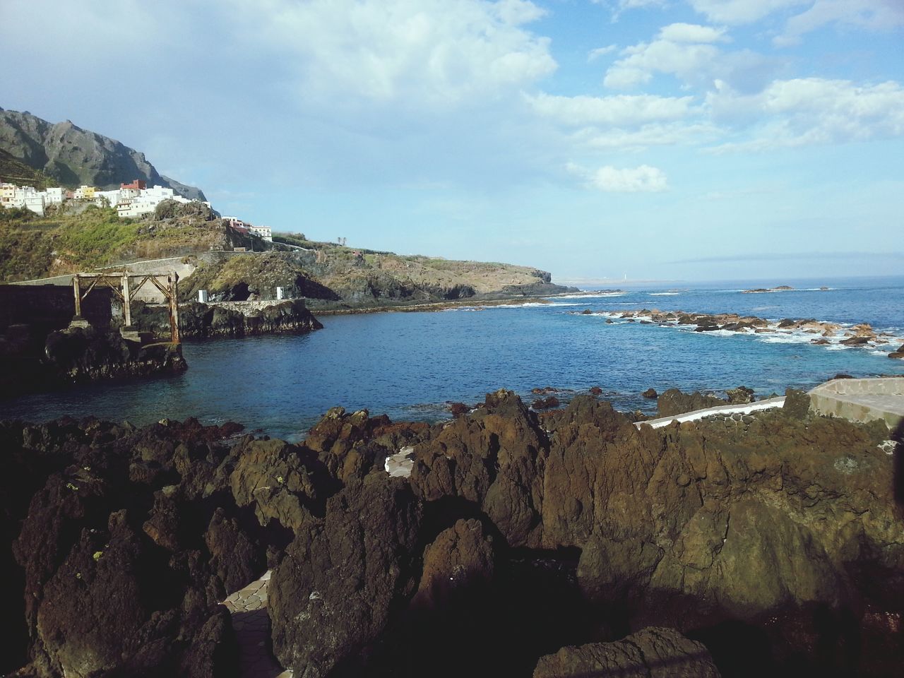 sea, water, sky, horizon over water, rock - object, scenics, tranquil scene, tranquility, beauty in nature, beach, nature, shore, cloud - sky, rock formation, idyllic, rock, coastline, cloud, blue, outdoors