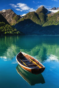 Scenic view of lake by mountains against sky, hjelle, norway