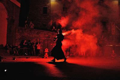 Woman standing in music concert