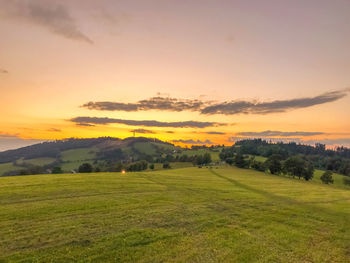 Scenic view of landscape against sky during sunset