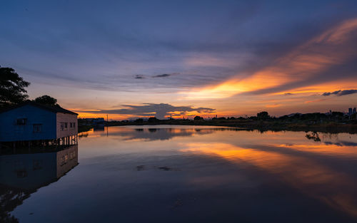 Scenic view of lake against sky during sunset