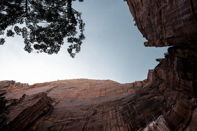 Low angle view of rocky cliff against sky at zion national park