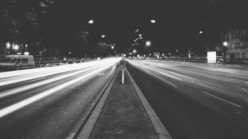 Light trails on street in city at night