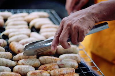 Cropped image of man preparing food