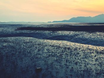 Scenic view of sea against sky during sunset