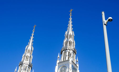 Low angle view of cathedral against clear blue sky