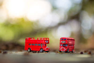 Close-up of red toy car on table