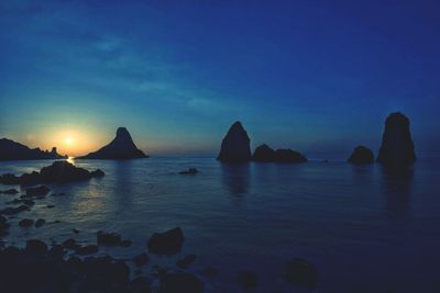 Scenic view of sea against sky at sunset