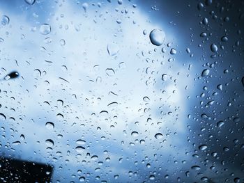 Full frame shot of raindrops on glass window