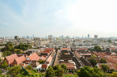 High angle view of buildings in city against sky