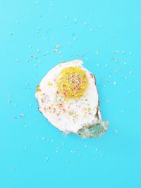 High angle view of ice cream against blue background