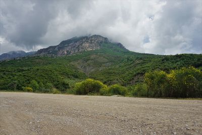 Scenic view of landscape and mountains against sky