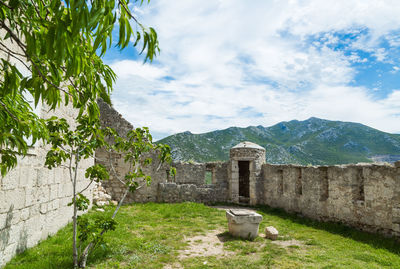 View of castle against cloudy sky