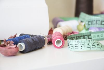 Close-up of sewing objects on table