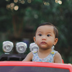 Portrait of cute girl looking away