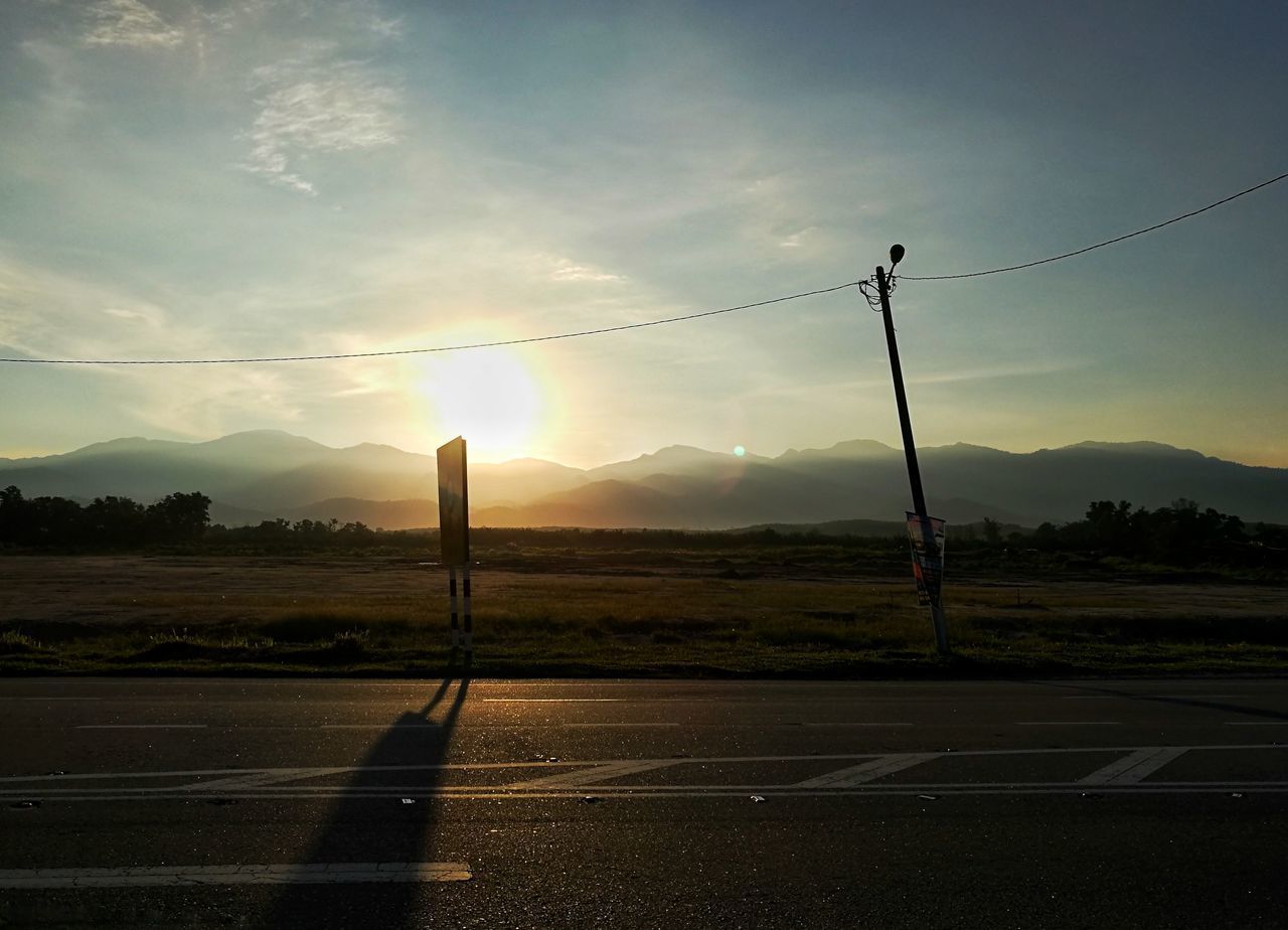 ROAD AGAINST SKY AT SUNSET