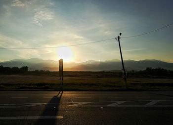 Road against sky during sunset