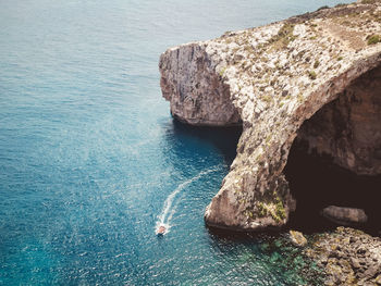 High angle view of rock formation in sea