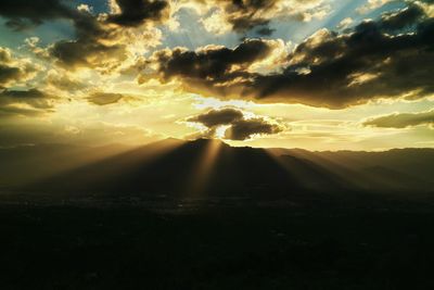 Scenic view of landscape against cloudy sky