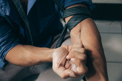 Close-up of man holding hands