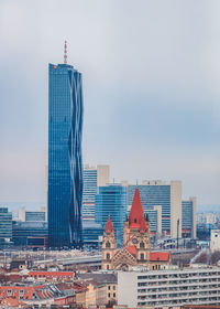 Modern buildings in city against sky