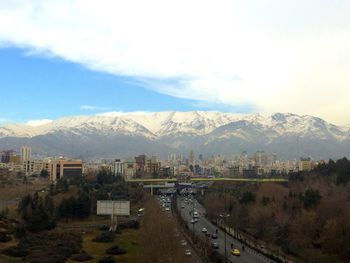 Scenic view of mountains against cloudy sky