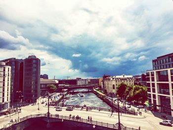 Buildings against cloudy sky