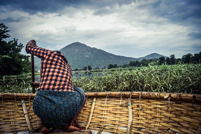 Rear view of woman on farm