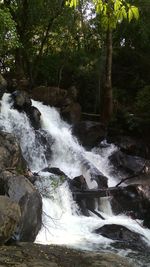 Scenic view of river flowing through rocks