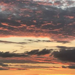 Low angle view of clouds in sky during sunset