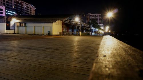 Illuminated city against sky at night