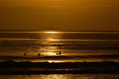 Scenic view of sea at sunset